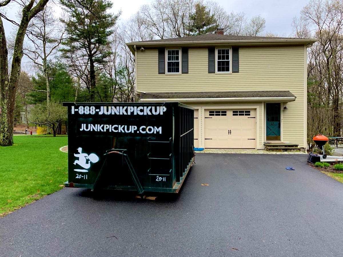 20 yard JunkPickup.com roll-off dumpster in a home driveway
